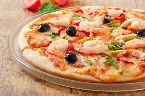 Pizza with Shrimp, Zucchini, Peppers and Olives Photo