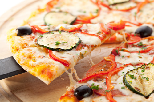 Pizza with Zucchini, Red Peppers and Onions Photo
